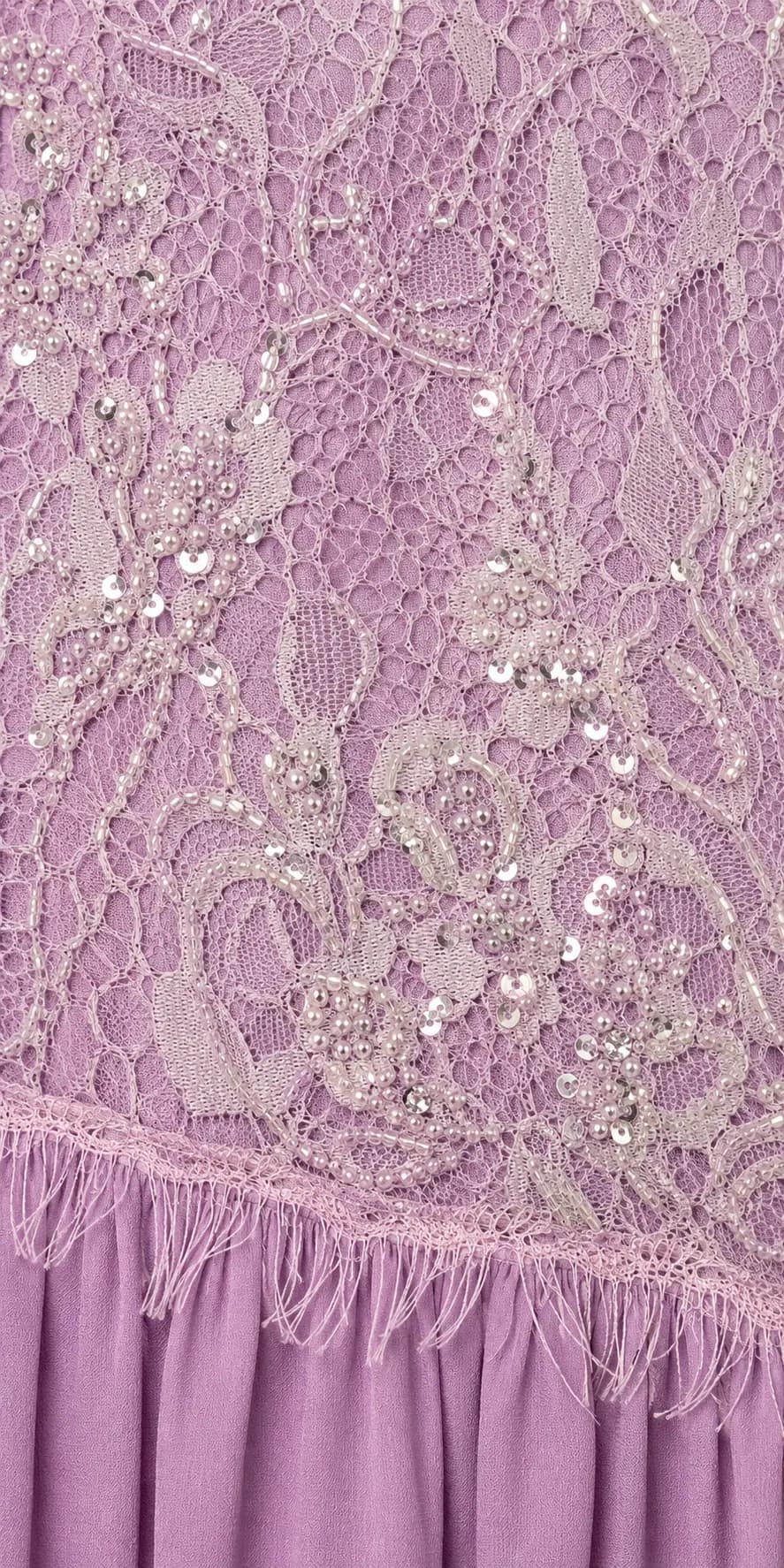 Close detail of hand-set embellishment on a Joie Couture bodice